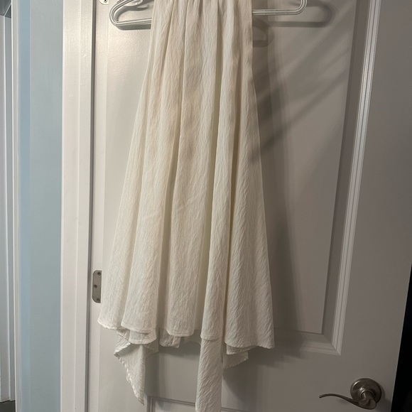 Renee C white asymmetrical hem top. Beautifully detailed with ruffle and bow. - Picture 3 of 3